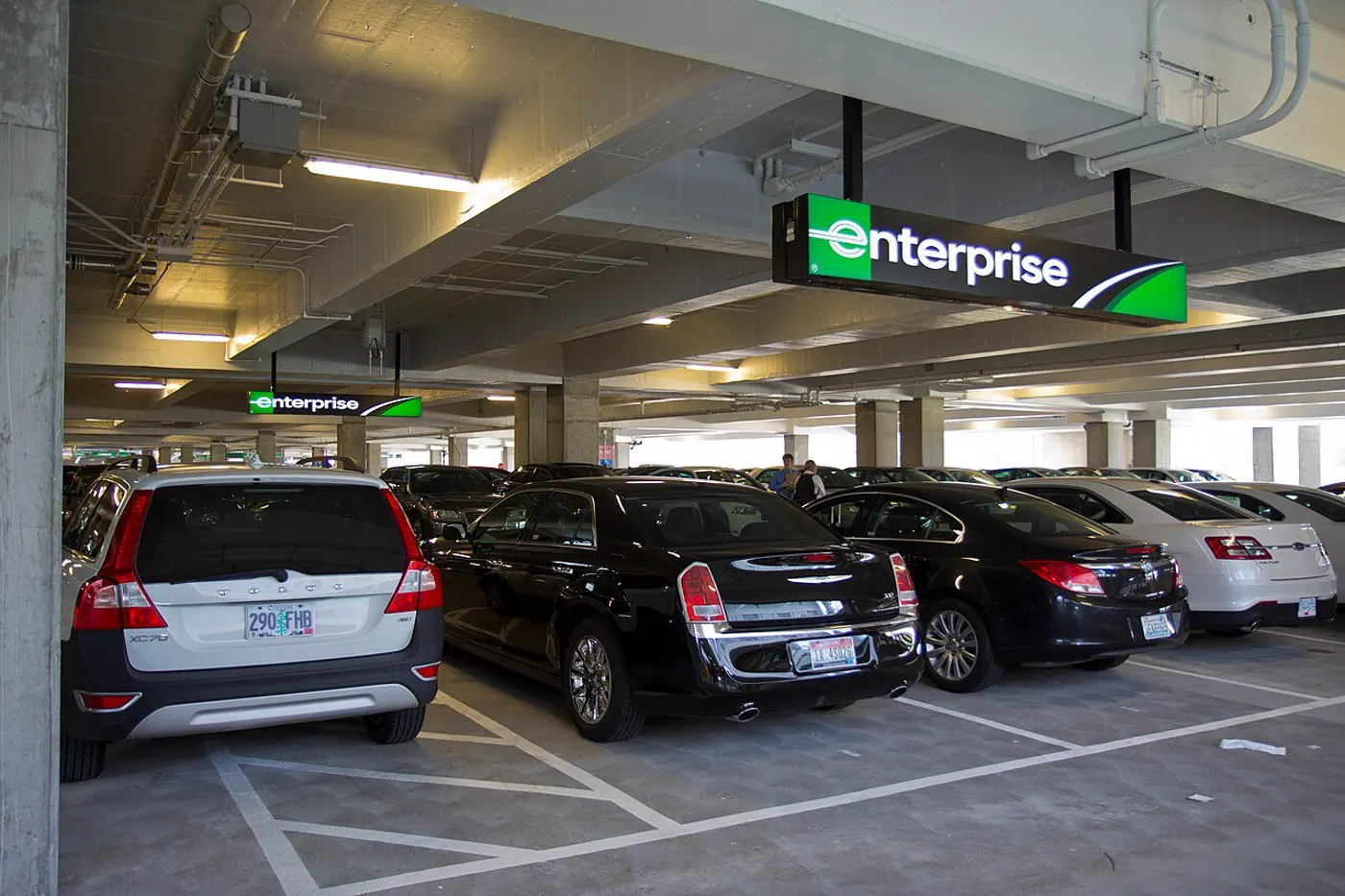 A row of rental cars in a rental garage